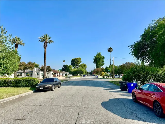 a view of a street with cars