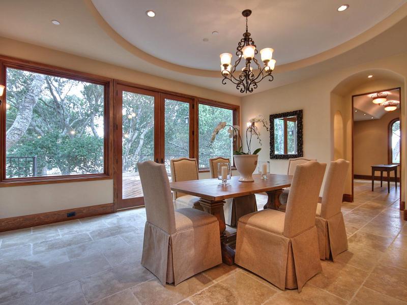 Monterra Oaks Road Monterey, CA 93940 - Photo 11 of 38 a dining room with furniture a large window and a chandelier