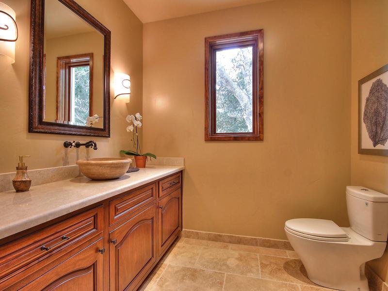 Monterra Oaks Road Monterey, CA 93940 - Photo 19 of 38 a bathroom with a toilet sink and mirror