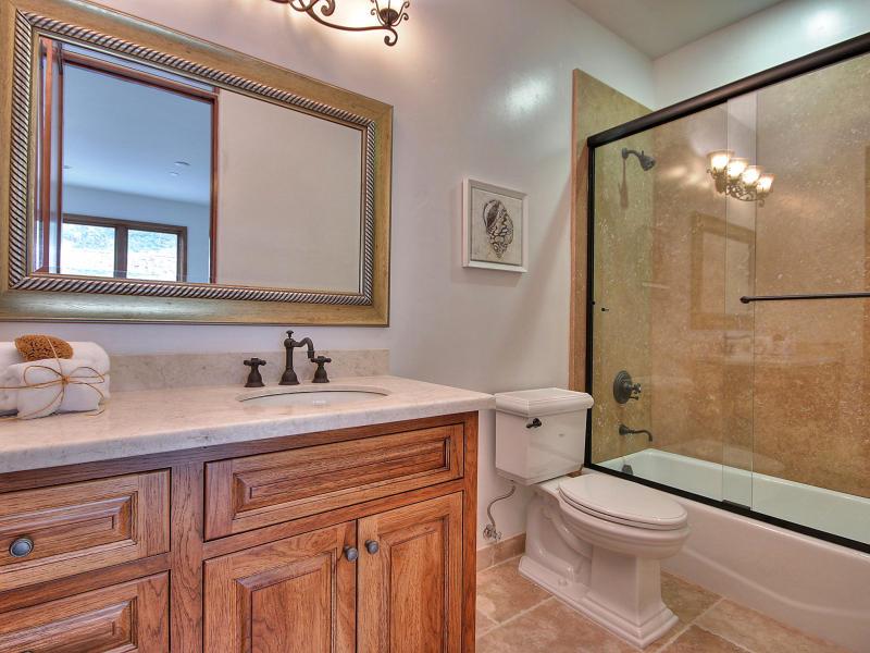Monterra Oaks Road Monterey, CA 93940 - Photo 27 of 38 a bathroom with a granite countertop sink mirror vanity and toilet