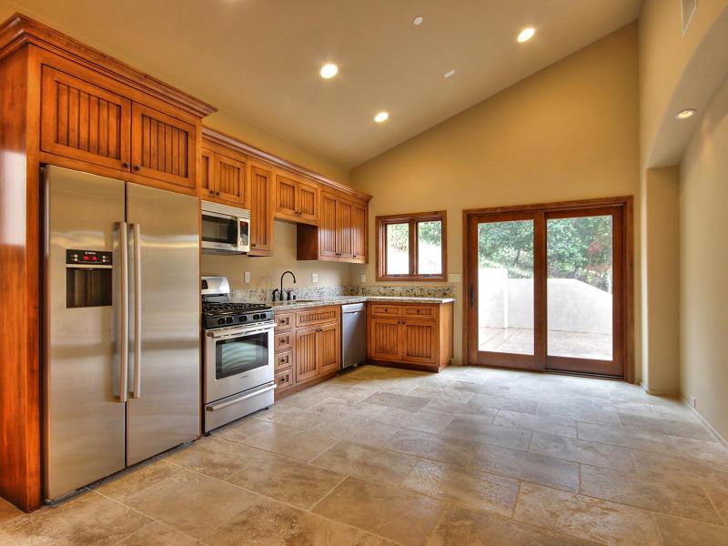 Monterra Oaks Road Monterey, CA 93940 - Photo 37 of 38 a large kitchen with stainless steel appliances granite countertop a refrigerator a stove and a sink with cabinets