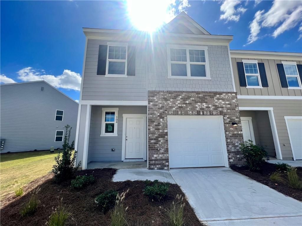 104 Rydal Way Winder, GA 30680 - Photo 1 of 1 a front view of a house with garden