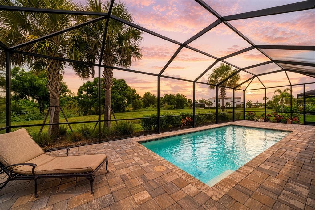 16341 Hidden Oak Loop Lakewood Ranch, FL 34211 - Photo 59 of 76 a view of a swimming pool with a patio