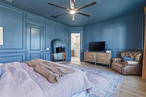 a bedroom with a bed and a couch