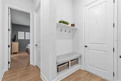 a area with wooden floor and closet