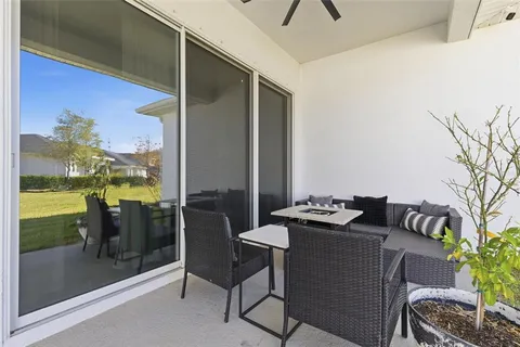 a front view of a house with outdoor seating