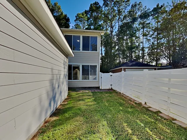 a view of a back yard of the house