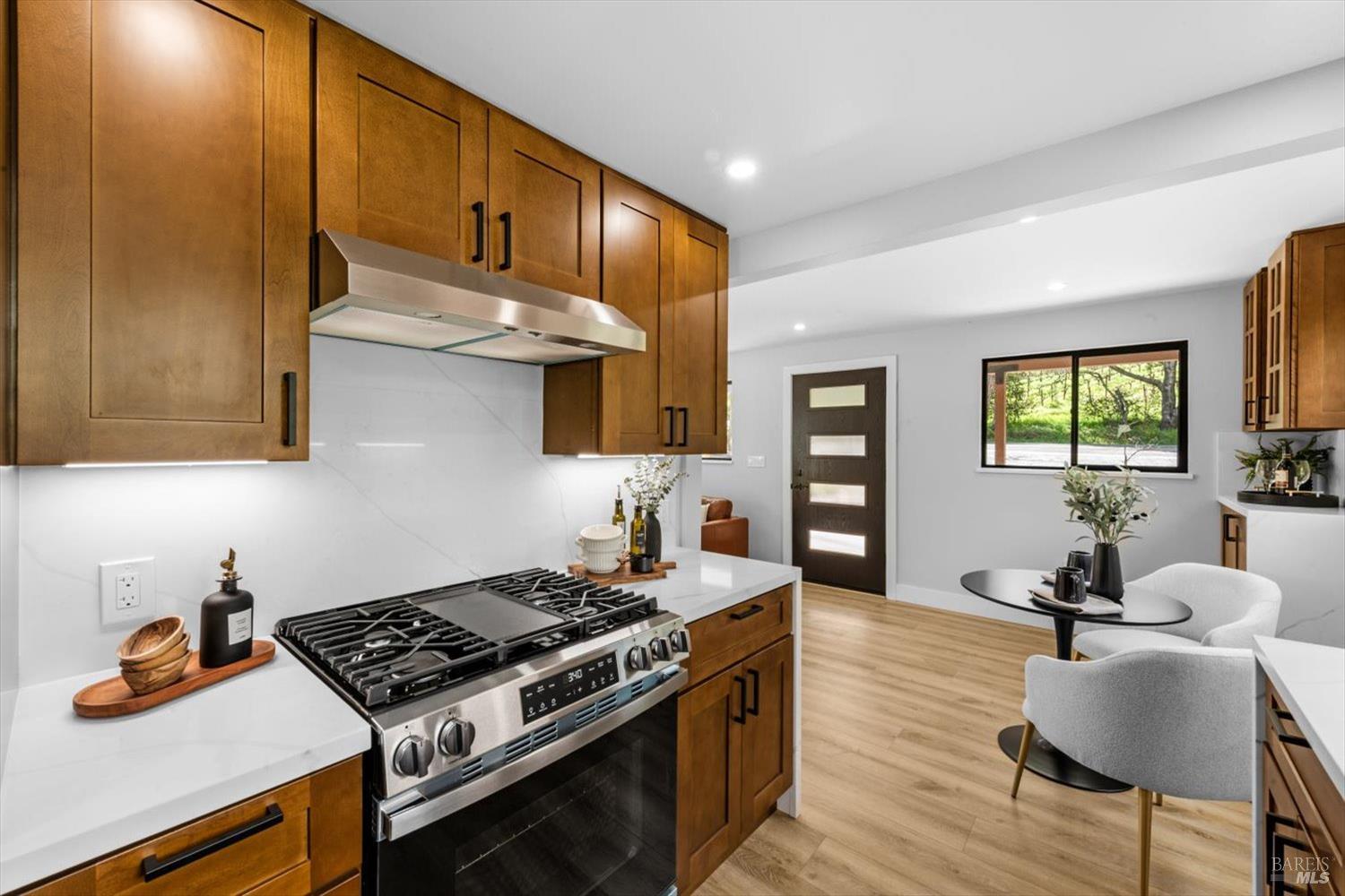 2192 First Avenue Napa, CA 94558 - Photo 20 of 81 a kitchen with stainless steel appliances granite countertop a stove a sink dishwasher and cabinets with wooden floor