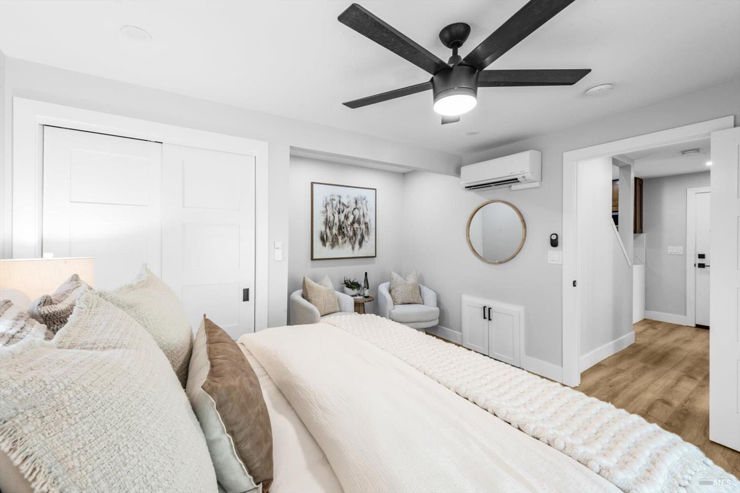 2192 First Avenue Napa, CA 94558 - Photo 31 of 81 a bedroom with a large bed and a chandelier