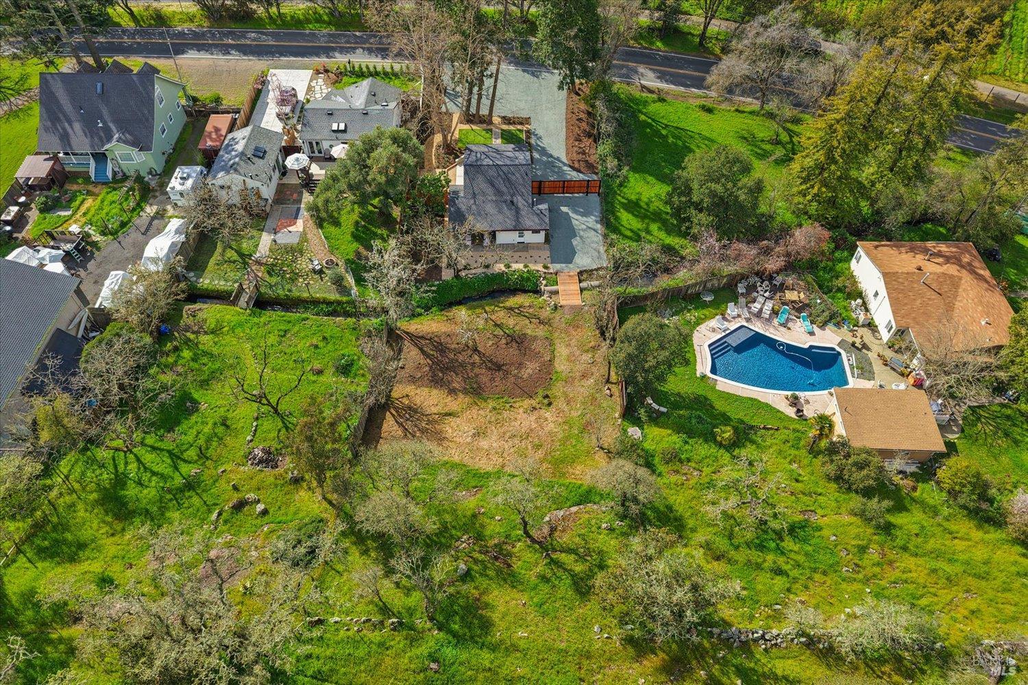 2192 First Avenue Napa, CA 94558 - Photo 75 of 81 a aerial view of a house with a yard and large trees