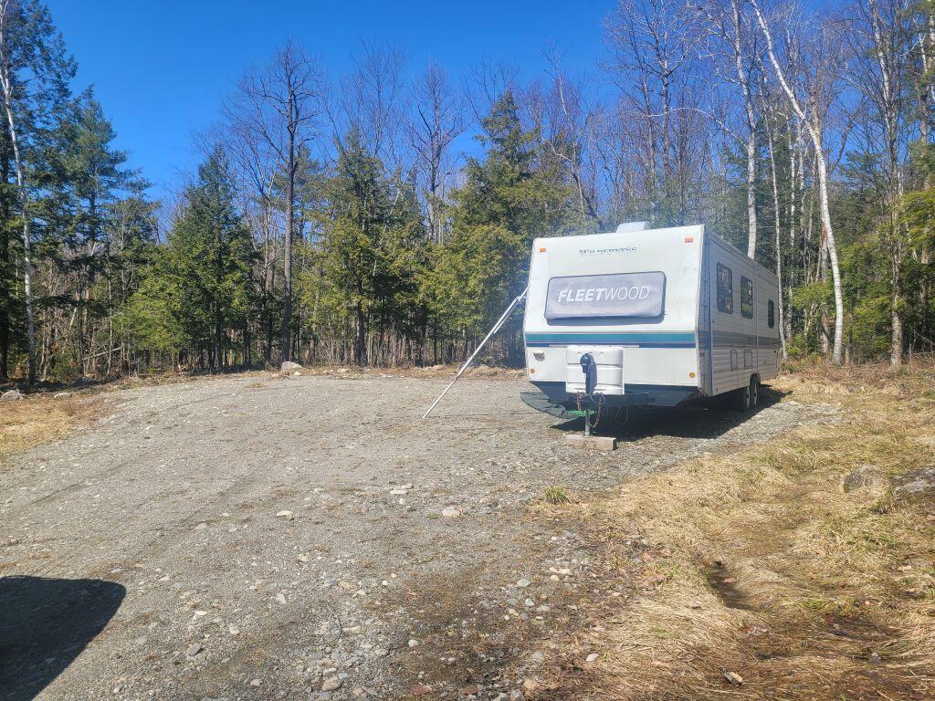 187 Lancaster Road Canaan, ME 04924 - Photo 5 of 9 Cleared area and camper
