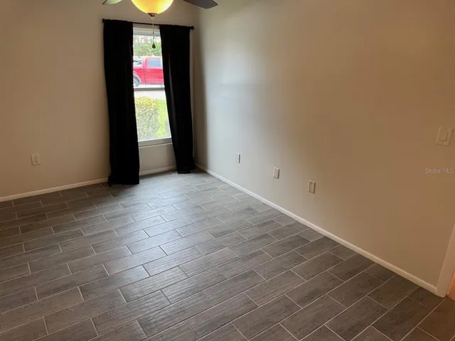 a view of an empty room and window