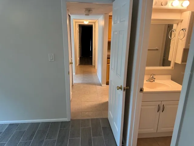 a view of a bathroom from a hallway