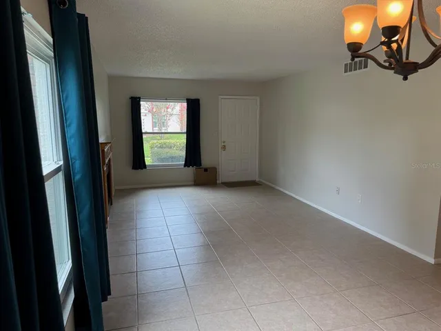 a view of an empty room and window