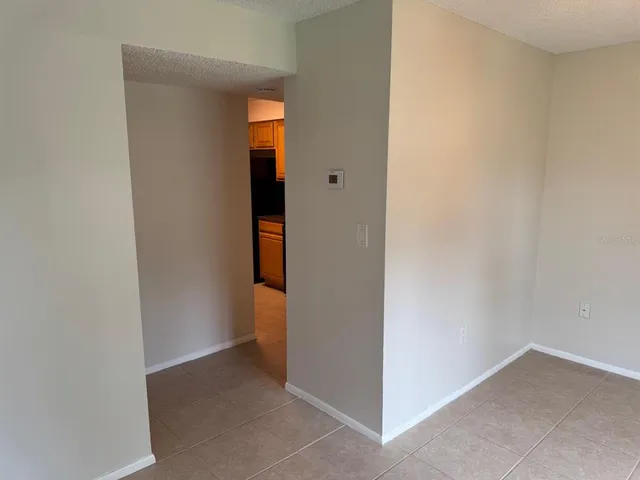 a view of a hallway with an empty room