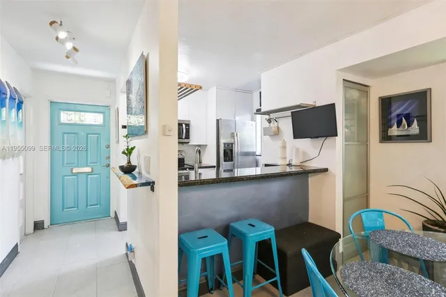 a view of kitchen with furniture and wooden floor