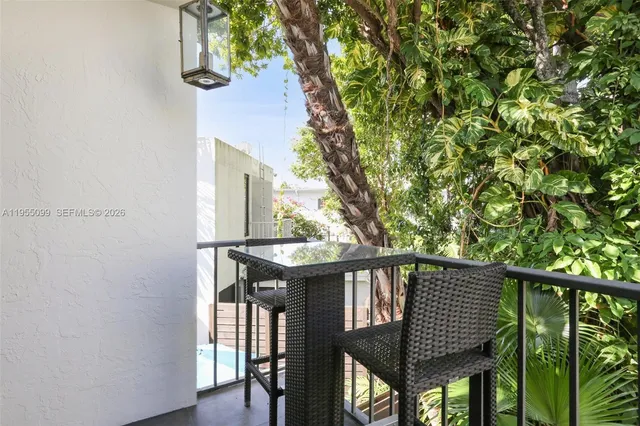 a view of a balcony with furniture