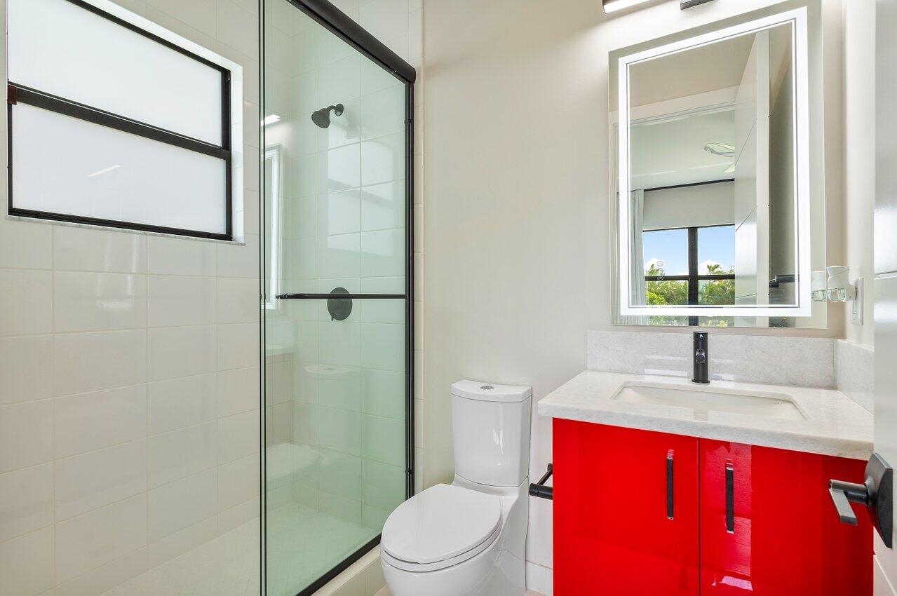 17464 Ponte Chiasso Drive Boca Raton, FL 33496 - Photo 29 of 37 a bathroom with a sink a toilet and shower