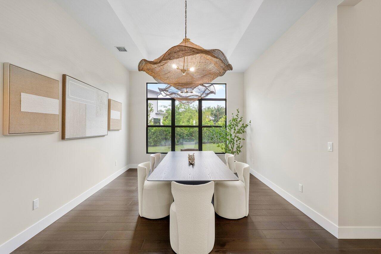 17464 Ponte Chiasso Drive Boca Raton, FL 33496 - Photo 8 of 37 a room with wooden floor and a large window