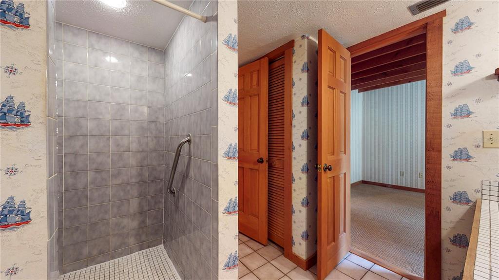 19803 Reading Road Lutz, FL 33558 - Photo 40 of 48 a bathroom with a shower and a sink