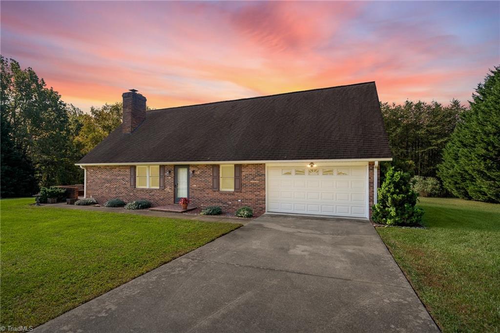 1210 Jones Road King, NC 27021 - Photo 1 of 30 Stunning 1.5 story brick home on a 1.5 acre lot with a fantastic country setting.