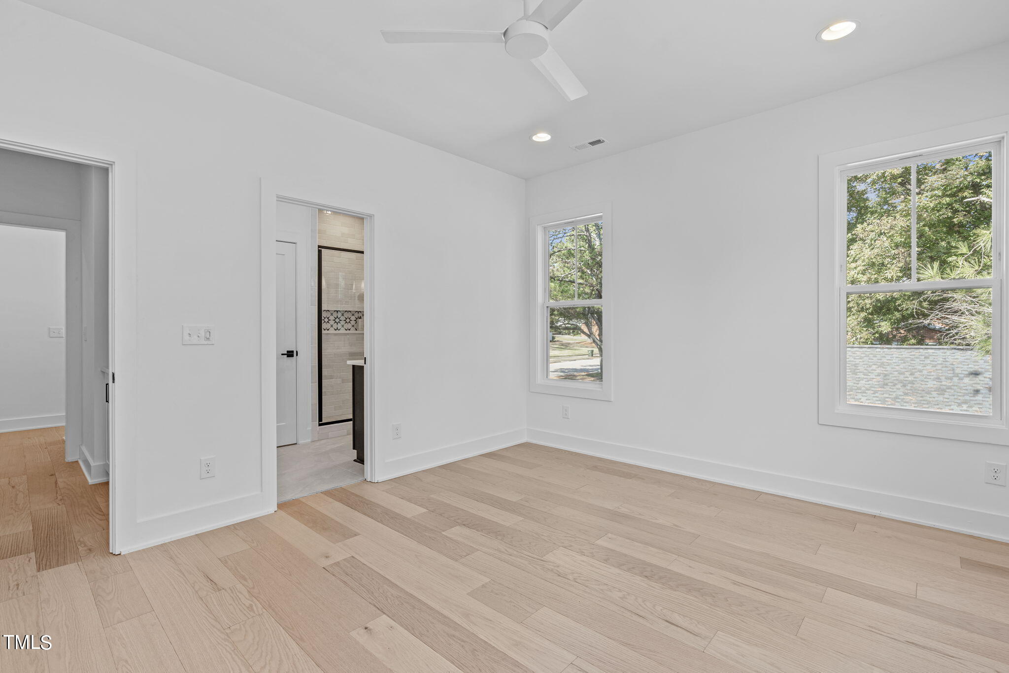 853 Athens Drive, Unit 101 Raleigh, NC 27606 - Photo 32 of 61 an empty room with windows and closet
