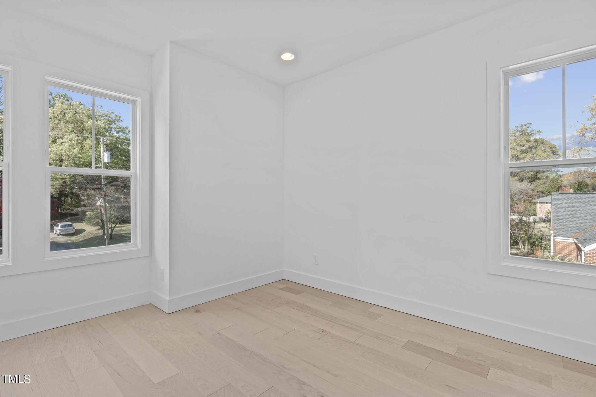 853 Athens Drive, Unit 101 Raleigh, NC 27606 - Photo 39 of 61 an empty room with a window
