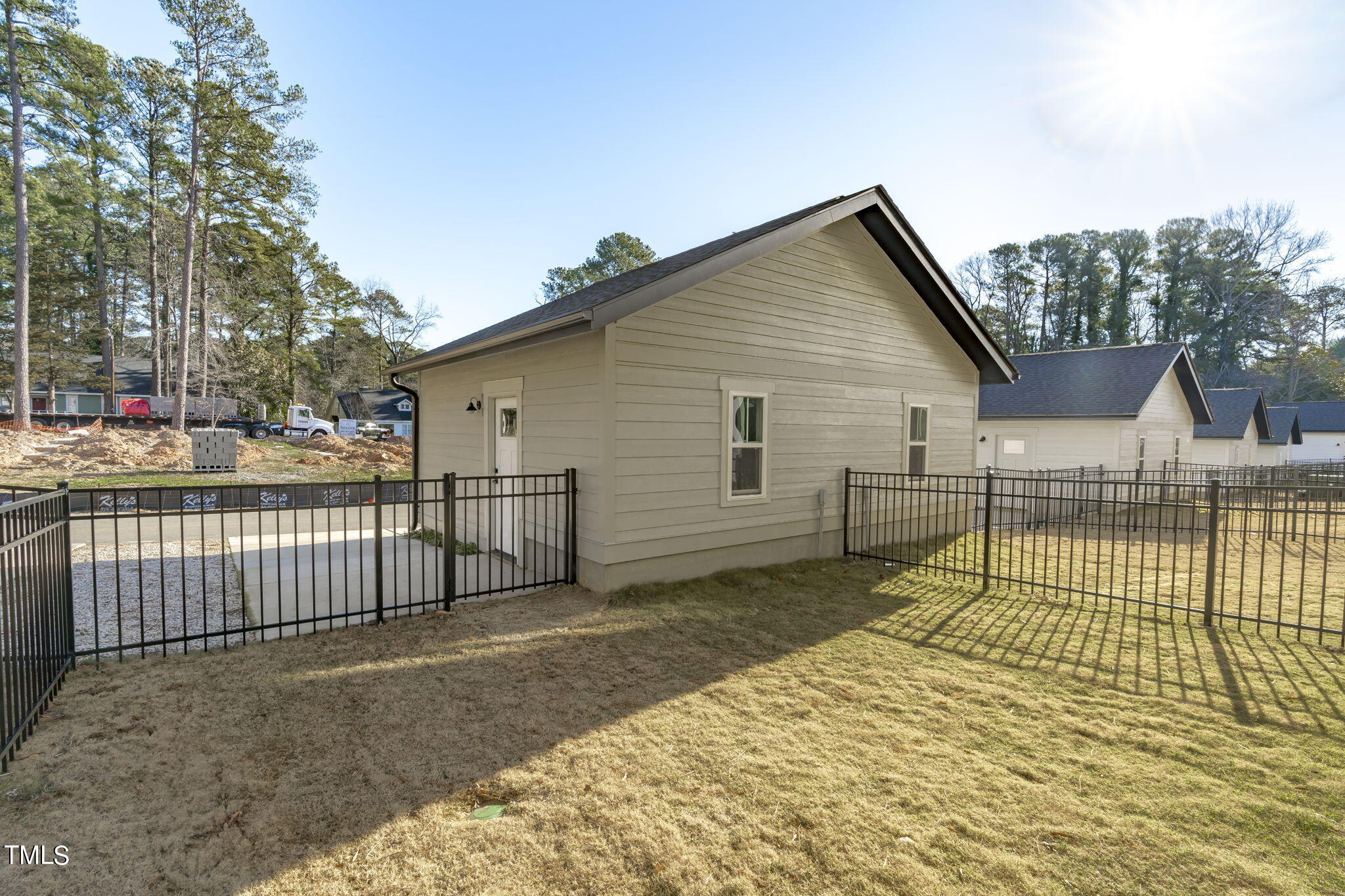 853 Athens Drive, Unit 101 Raleigh, NC 27606 - Photo 43 of 61 a view of a house with a backyard
