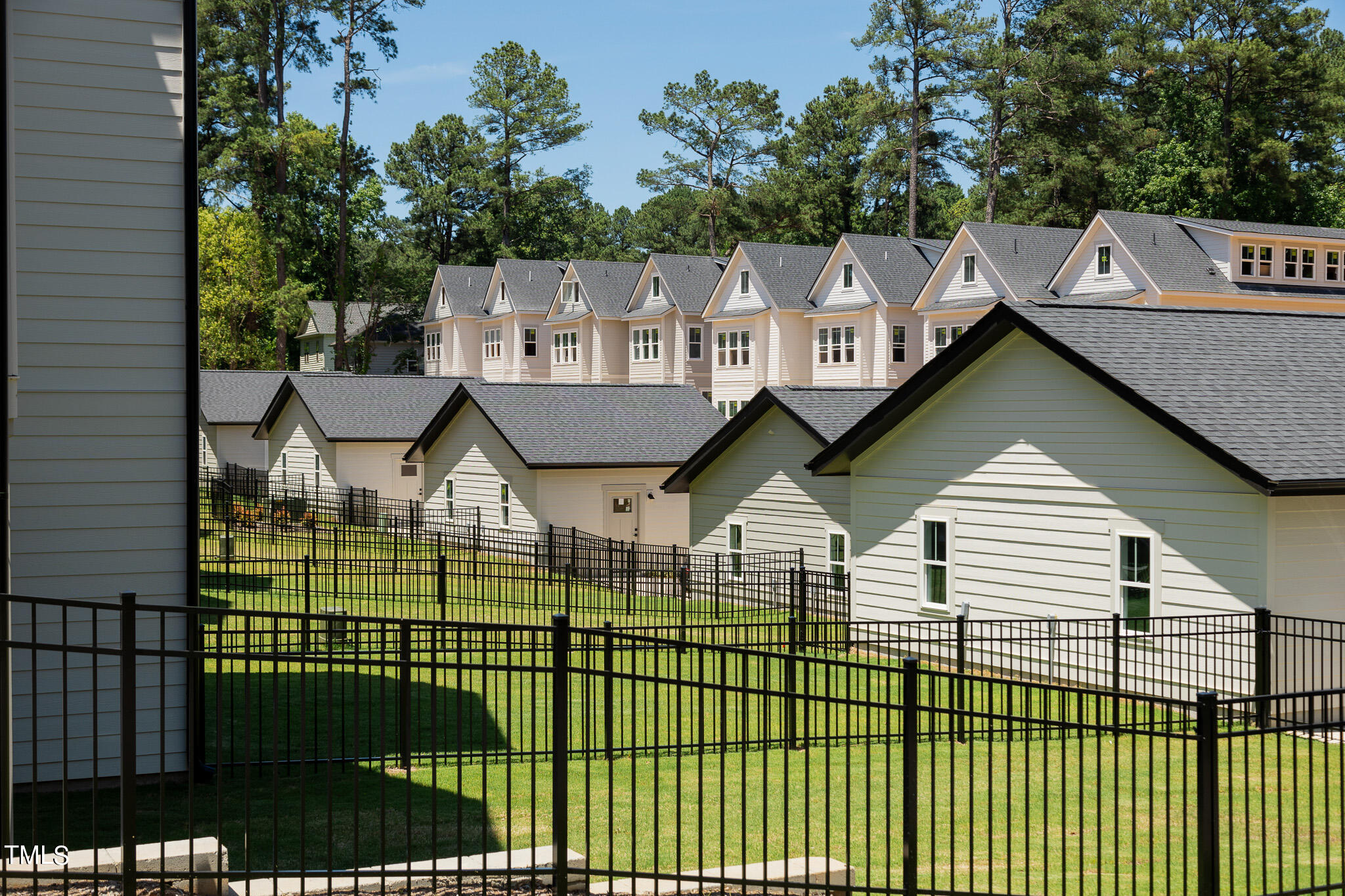 853 Athens Drive, Unit 101 Raleigh, NC 27606 - Photo 47 of 61 a view of a house and a yard