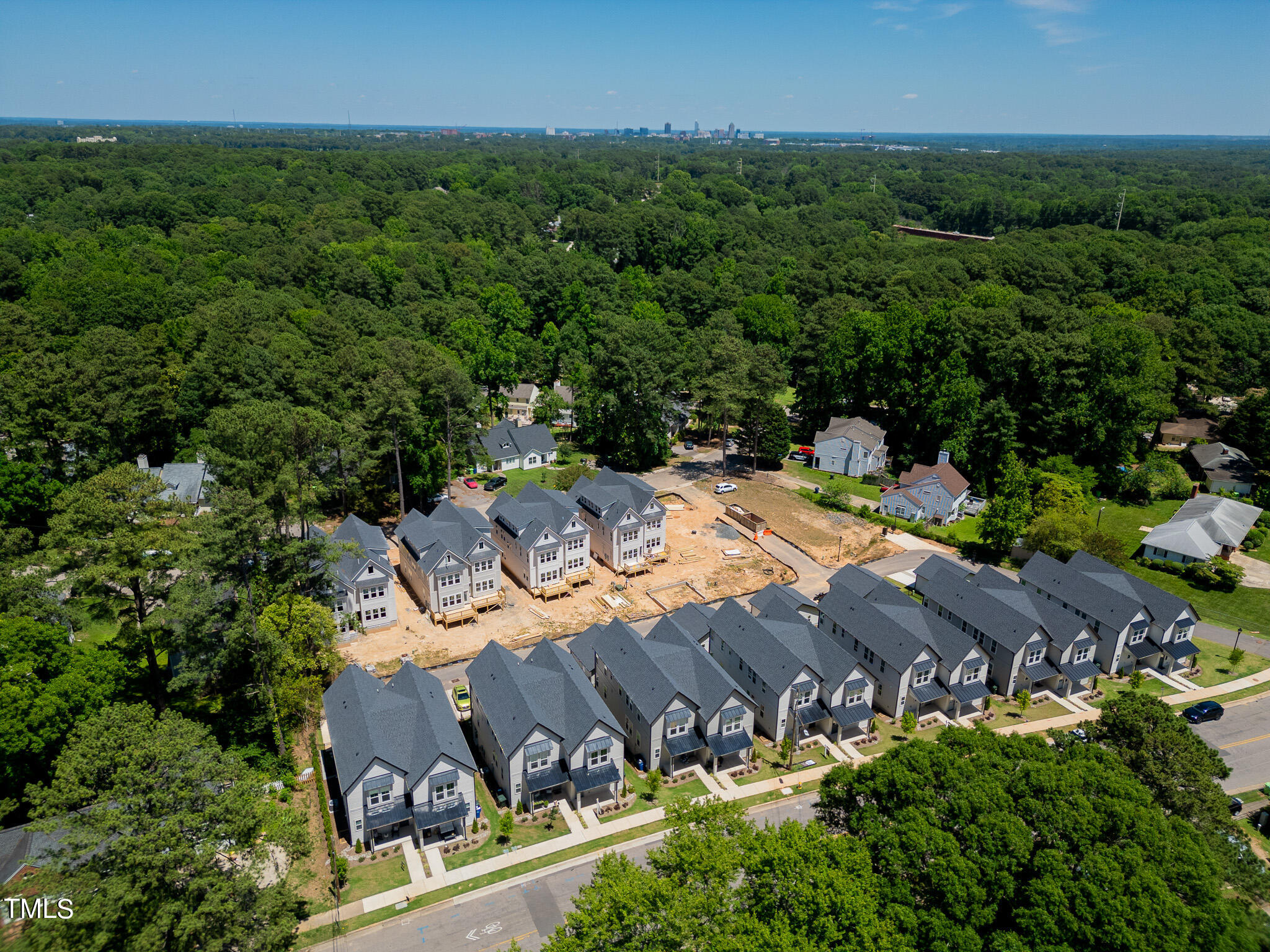 853 Athens Drive, Unit 101 Raleigh, NC 27606 - Photo 51 of 61 an aerial view of a house with a yard