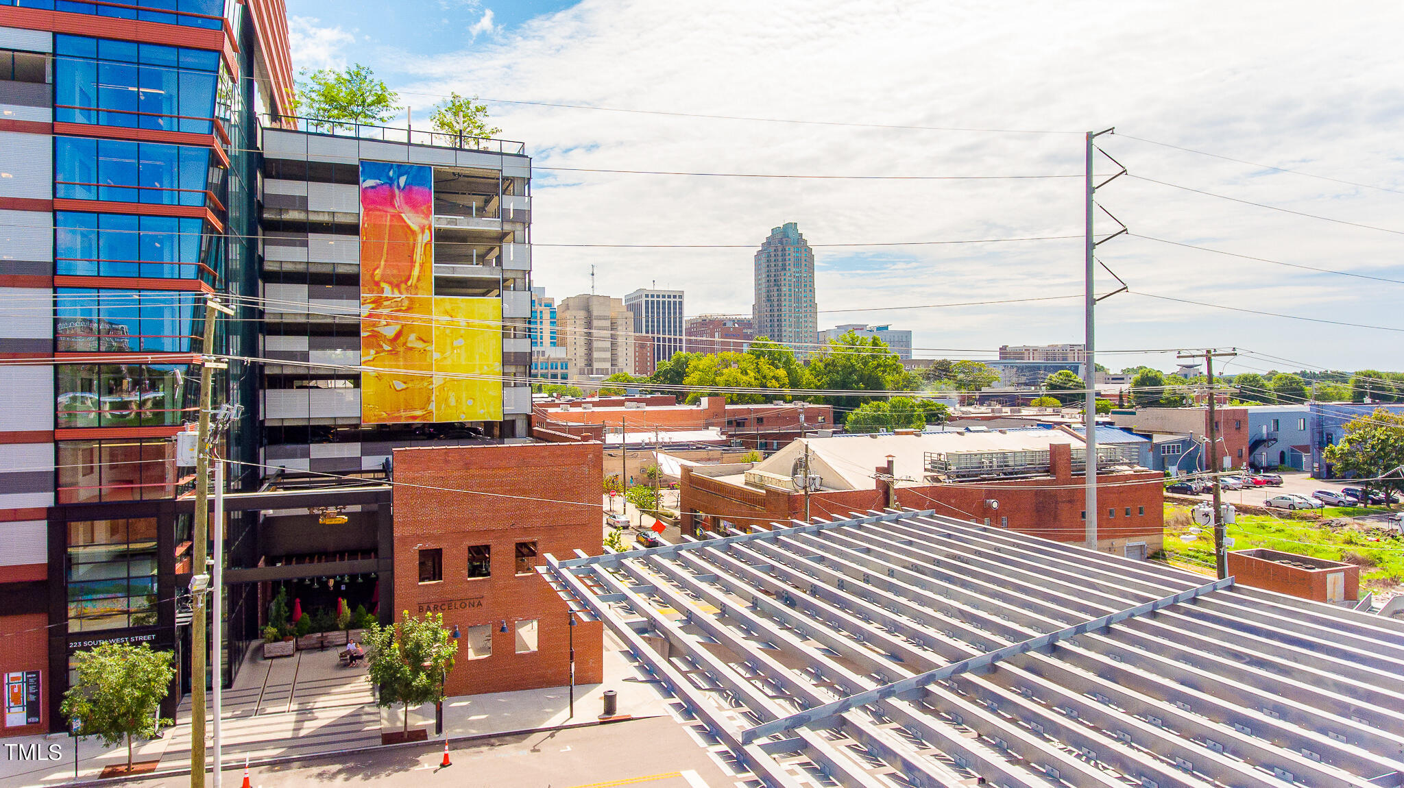853 Athens Drive, Unit 101 Raleigh, NC 27606 - Photo 61 of 61 a view of a city with tall buildings