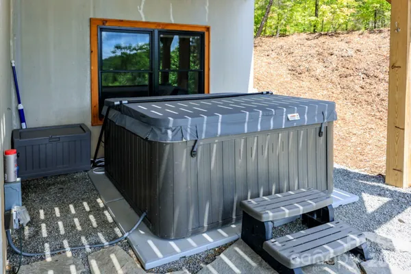 a view of roof deck with couch and chairs