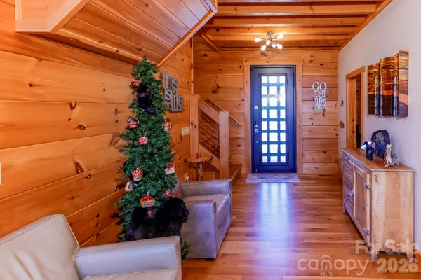a lobby with furniture and wooden floor