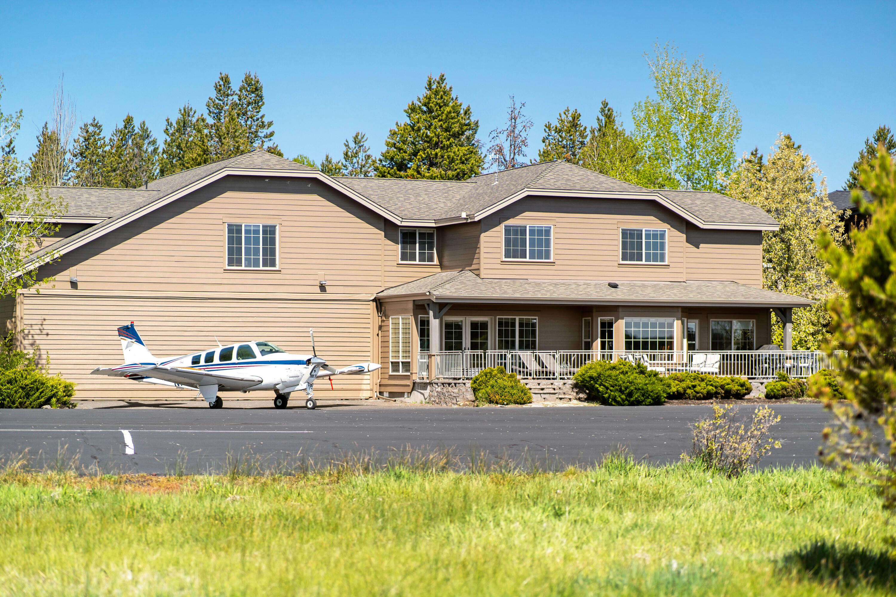 A one of a kind custom SunForest hangar home, situated in the exclusive Sky Park area in Sunriver!