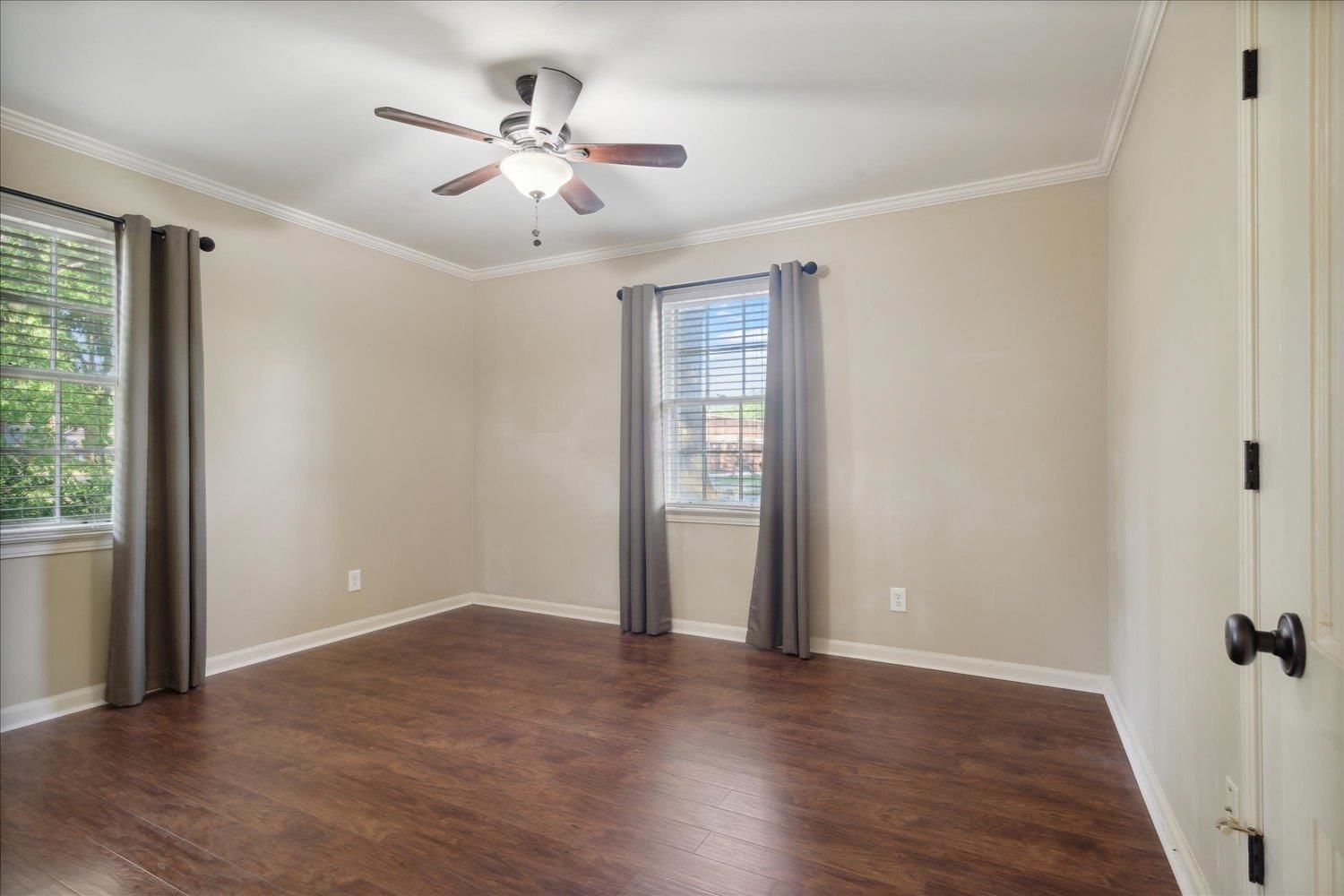 964 Ivy Road Memphis, TN 38117 - Photo 19 of 33 wooden floor in an empty room with a window
