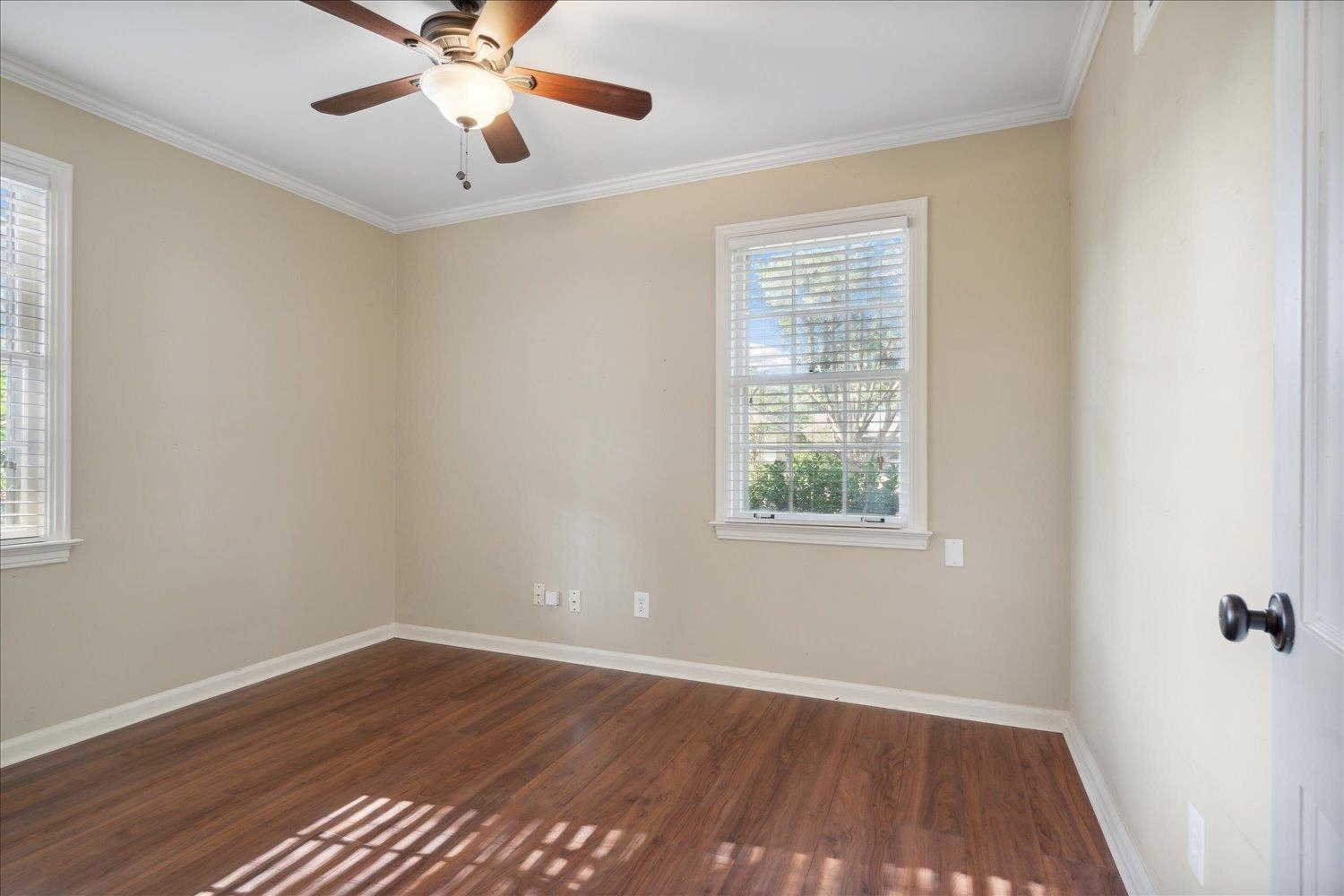 964 Ivy Road Memphis, TN 38117 - Photo 20 of 33 a view of an empty room with wooden floor and a window