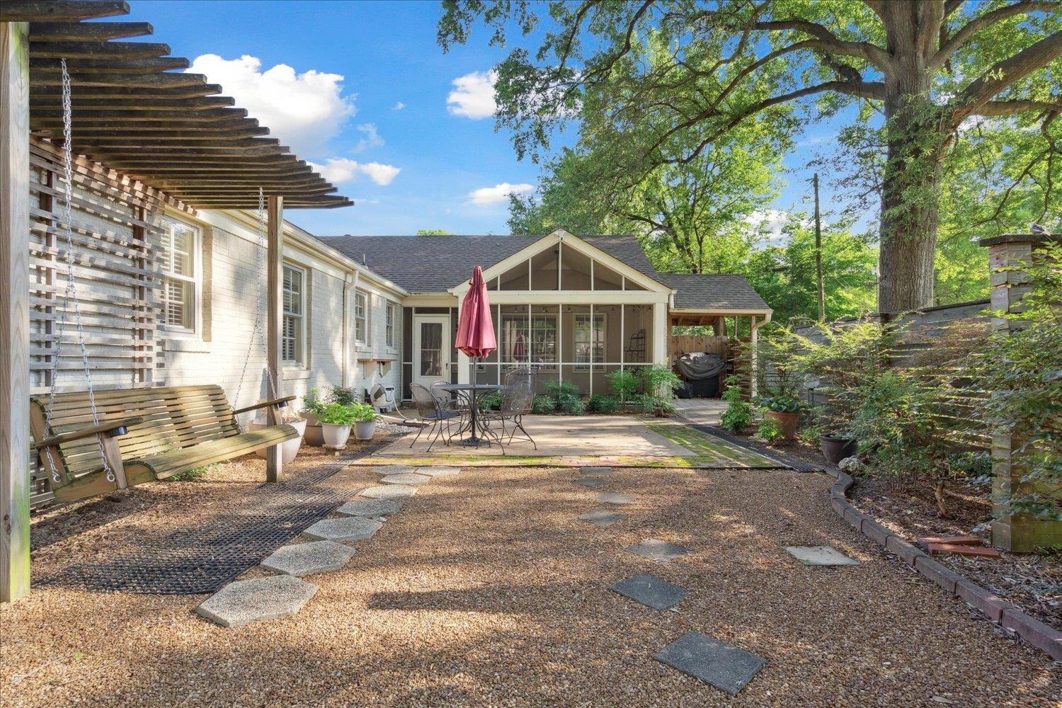 964 Ivy Road Memphis, TN 38117 - Photo 28 of 33 a front view of a house with a yard