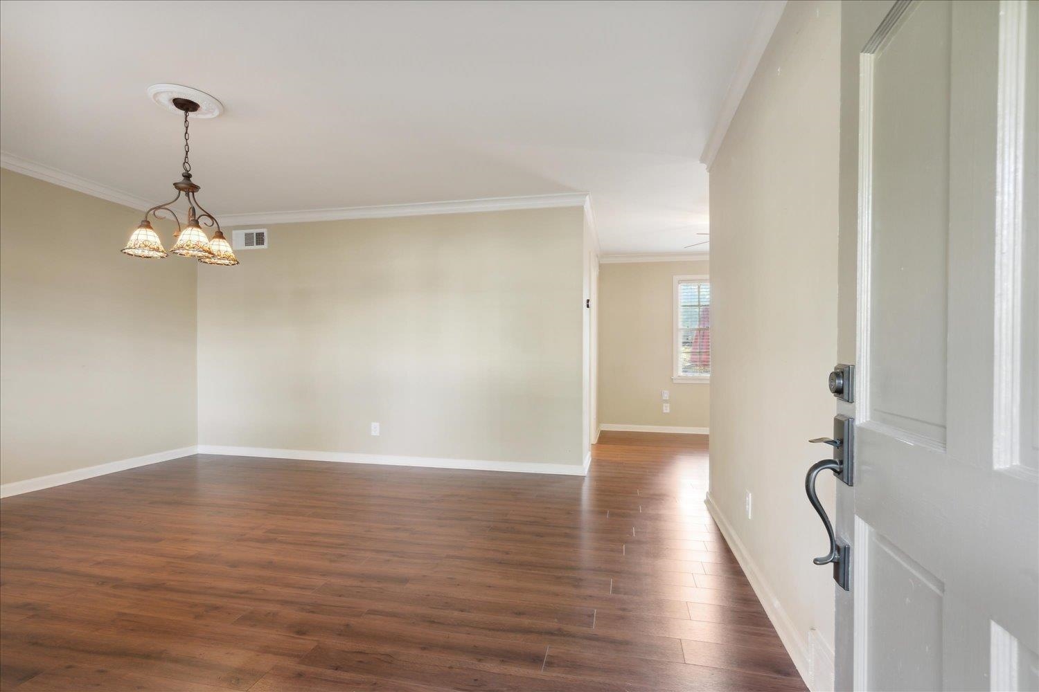 964 Ivy Road Memphis, TN 38117 - Photo 8 of 33 a view of a livingroom with wooden floor