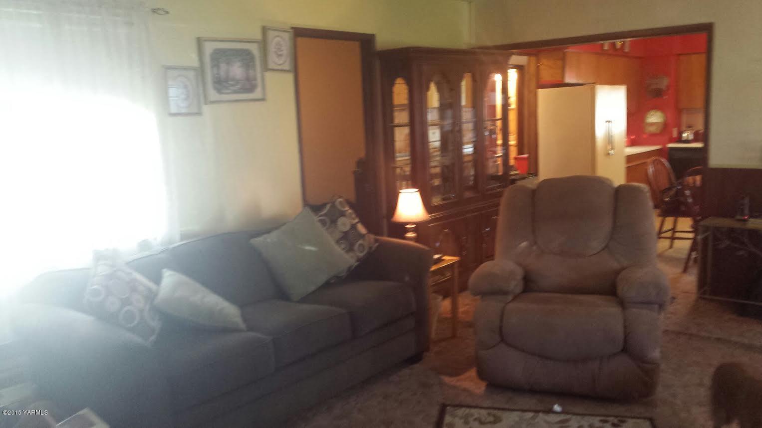 5490 Lateral A Road Wapato, WA 98951 - Photo 5 of 11 a living room with furniture and a large window
