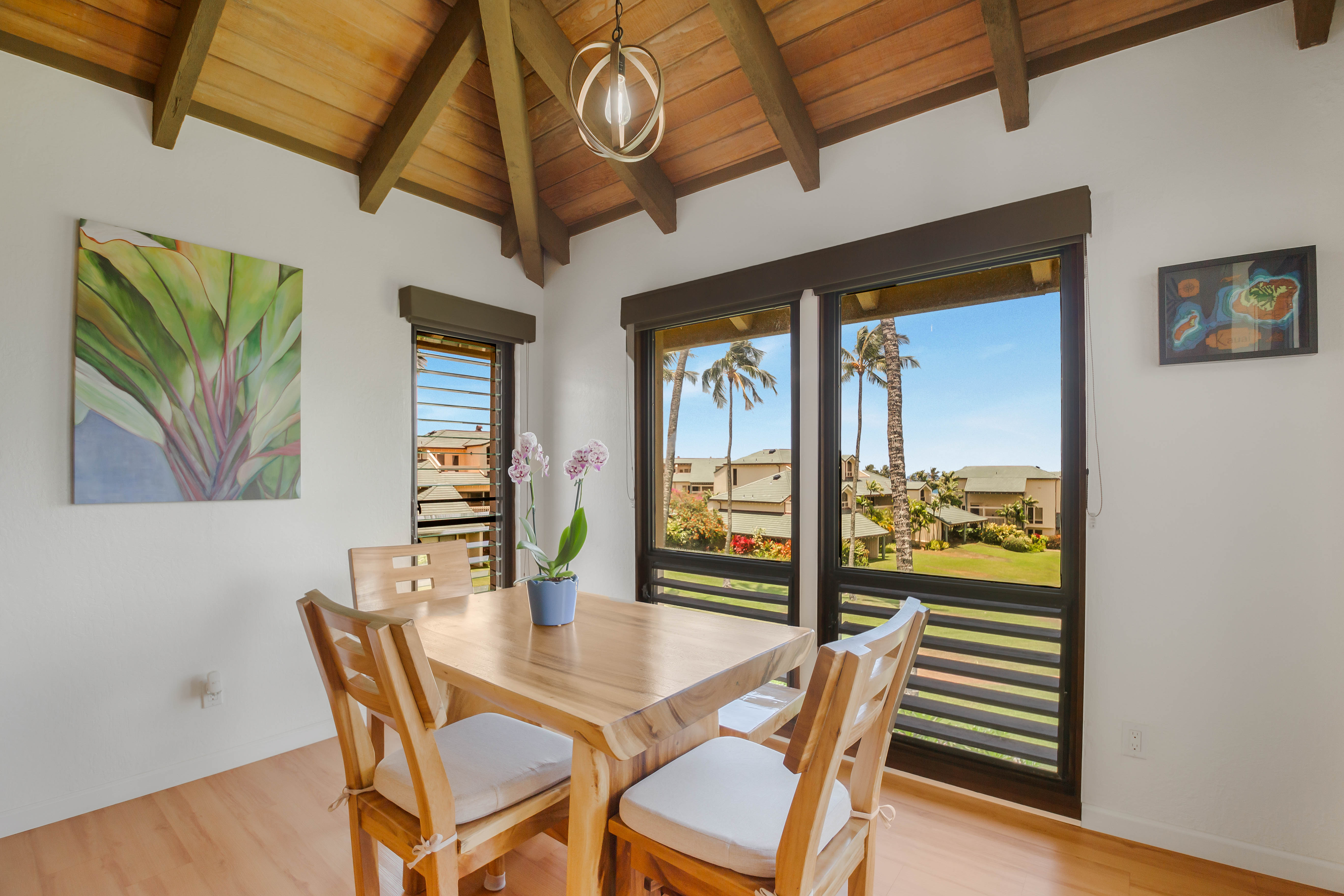 1901 Poipu Road, Unit 633 Koloa, HI 96756 - Photo 13 of 30 a dining room with furniture and wooden floor