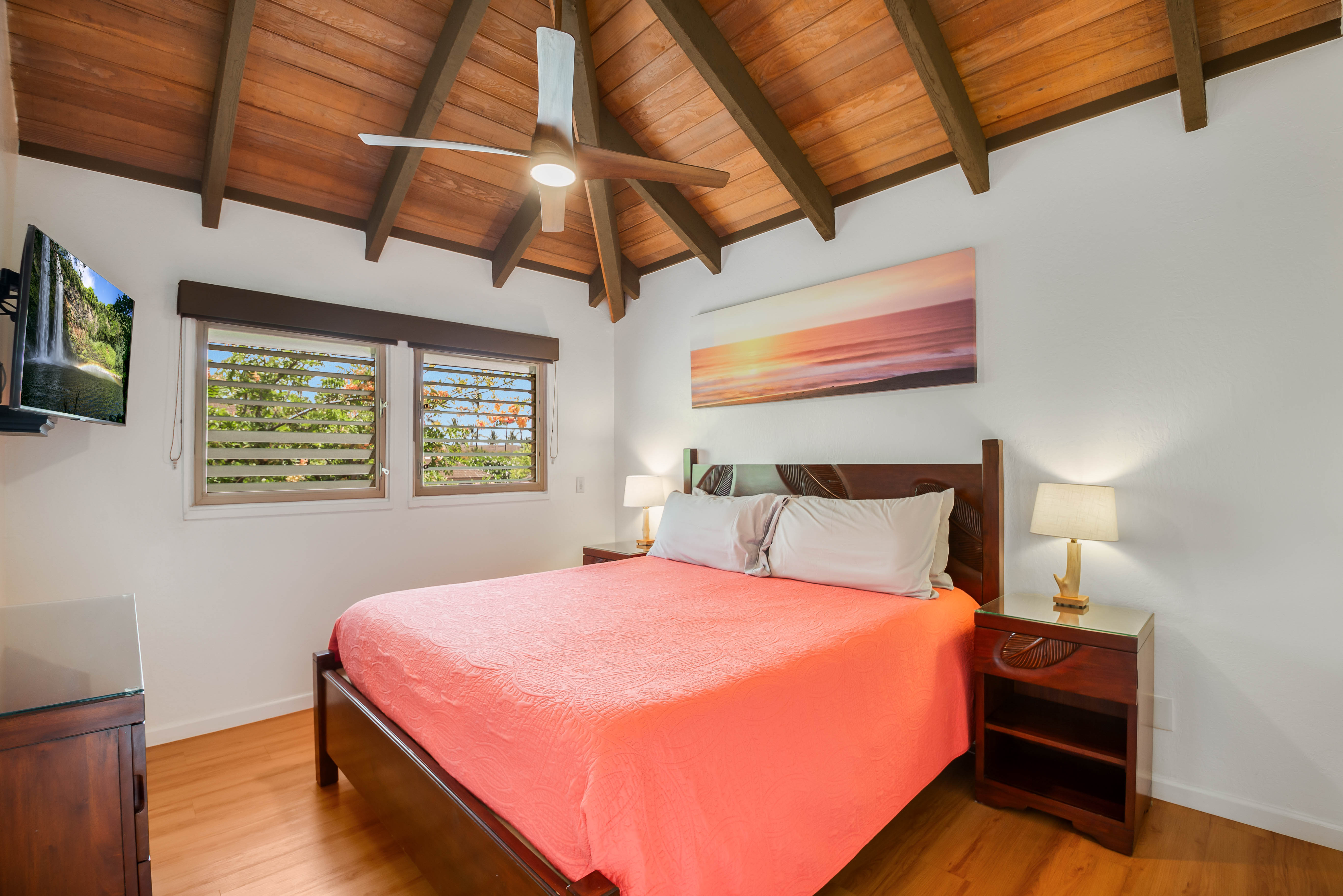 1901 Poipu Road, Unit 633 Koloa, HI 96756 - Photo 15 of 30 a bedroom with a bed and wooden floor