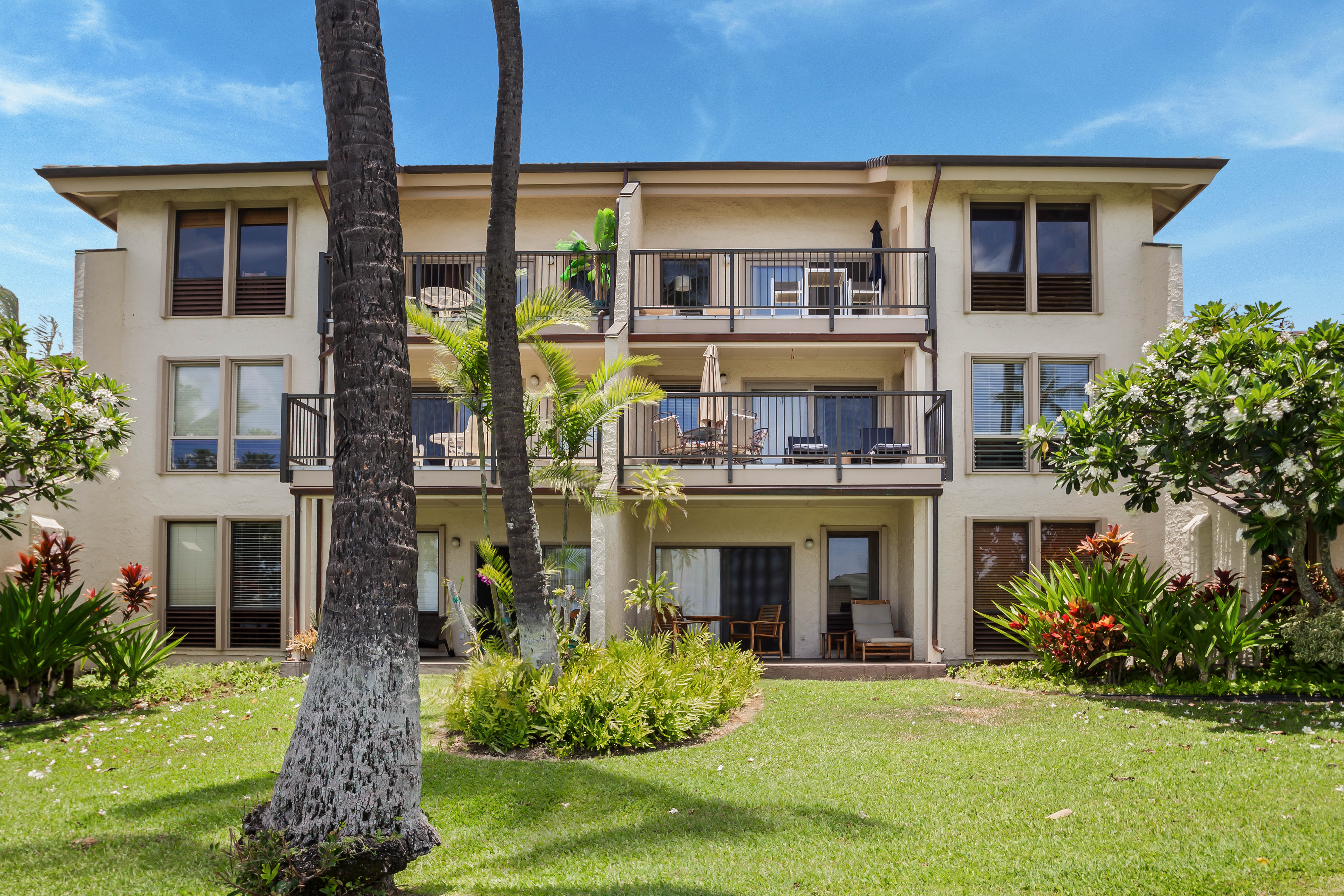 1901 Poipu Road, Unit 633 Koloa, HI 96756 - Photo 19 of 30 a front view of a house with a yard table and chairs
