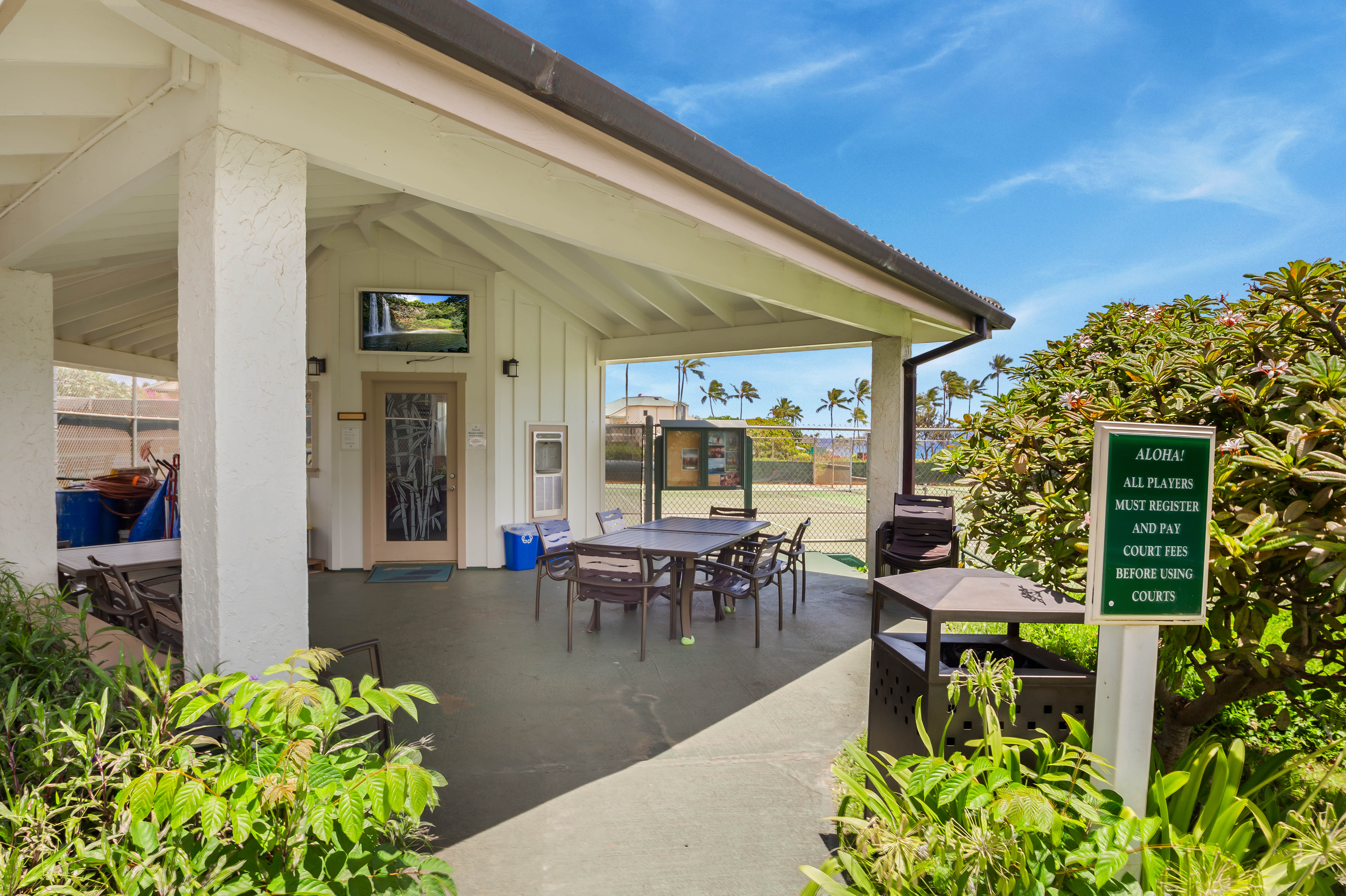1901 Poipu Road, Unit 633 Koloa, HI 96756 - Photo 26 of 30 a view of a patio with table and chairs and potted plants