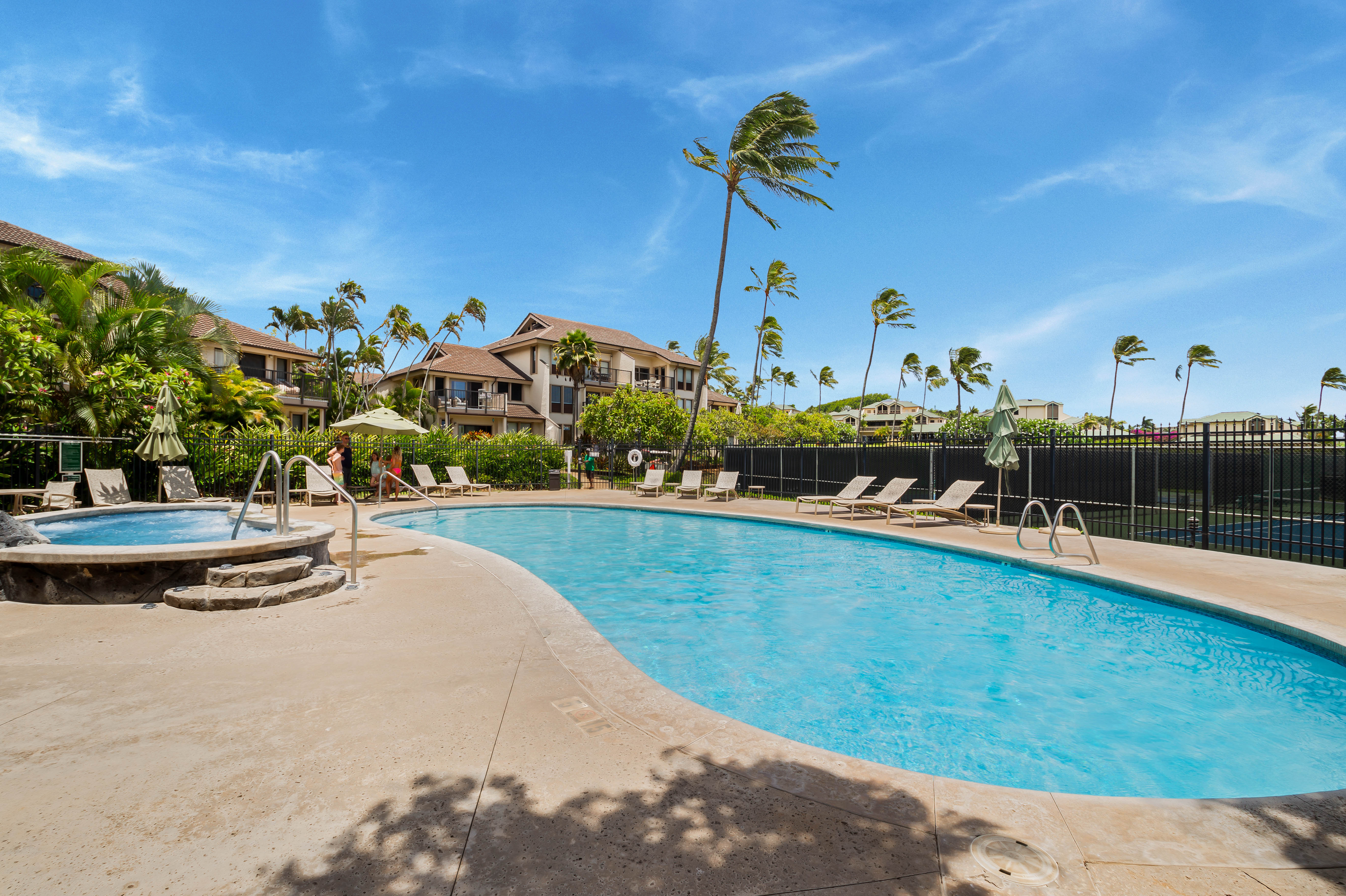 1901 Poipu Road, Unit 633 Koloa, HI 96756 - Photo 29 of 30 a view of a swimming pool with a lawn chairs and a yard