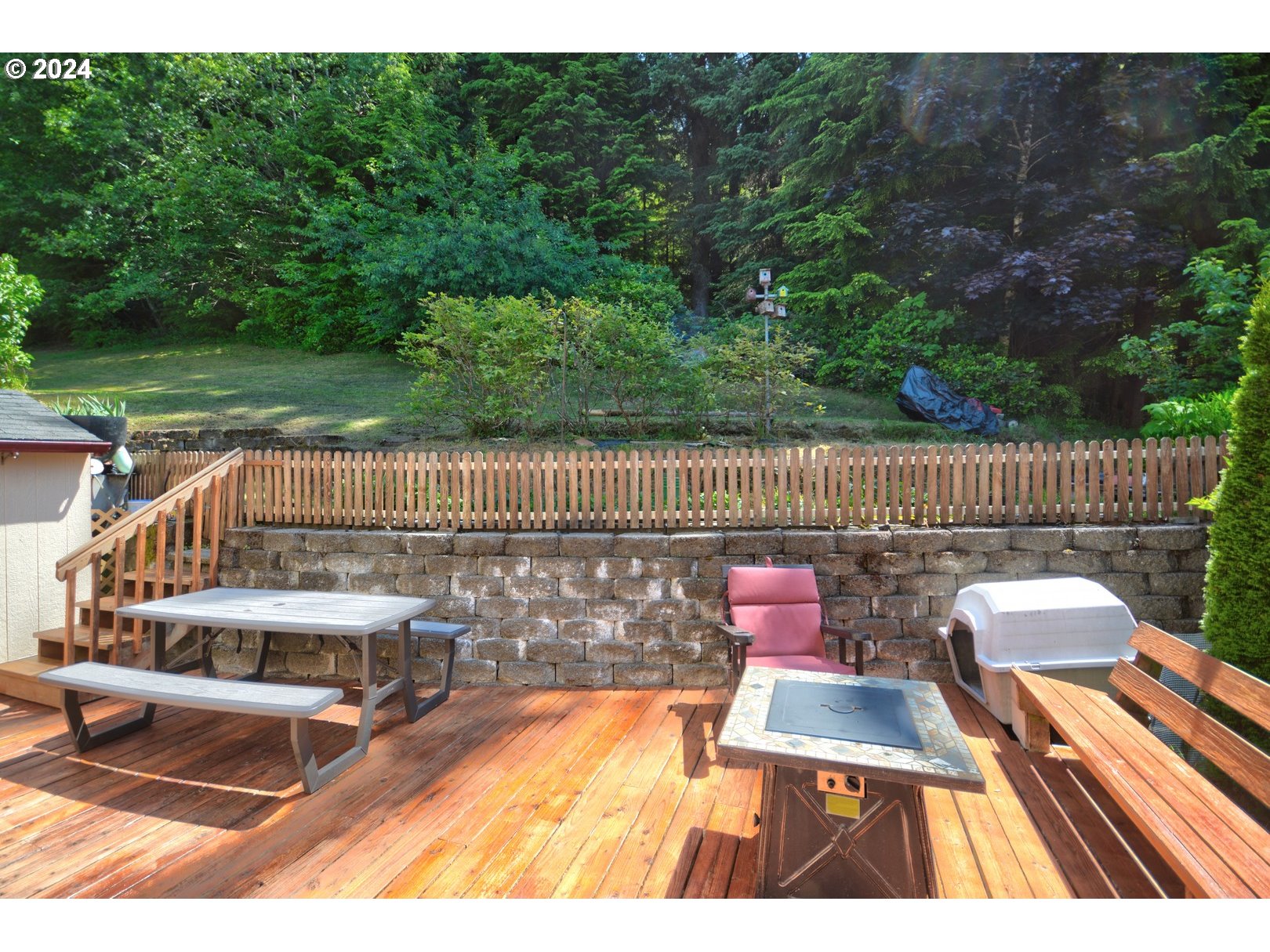 421 Elk Creek Road Cannon Beach, OR 97110 - Photo 14 of 16 a view of a chairs and table on the wooden floor
