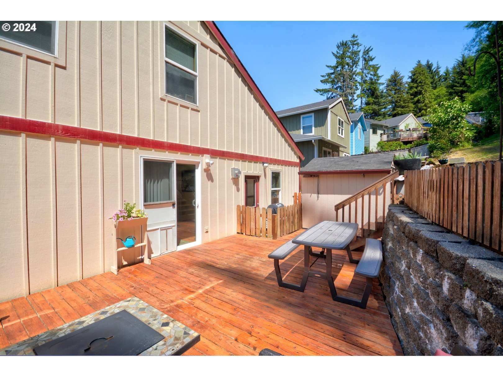 421 Elk Creek Road Cannon Beach, OR 97110 - Photo 16 of 16 a bedroom with furniture and a window