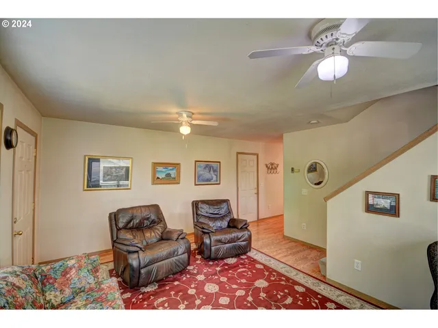 a living room with furniture and a lamp