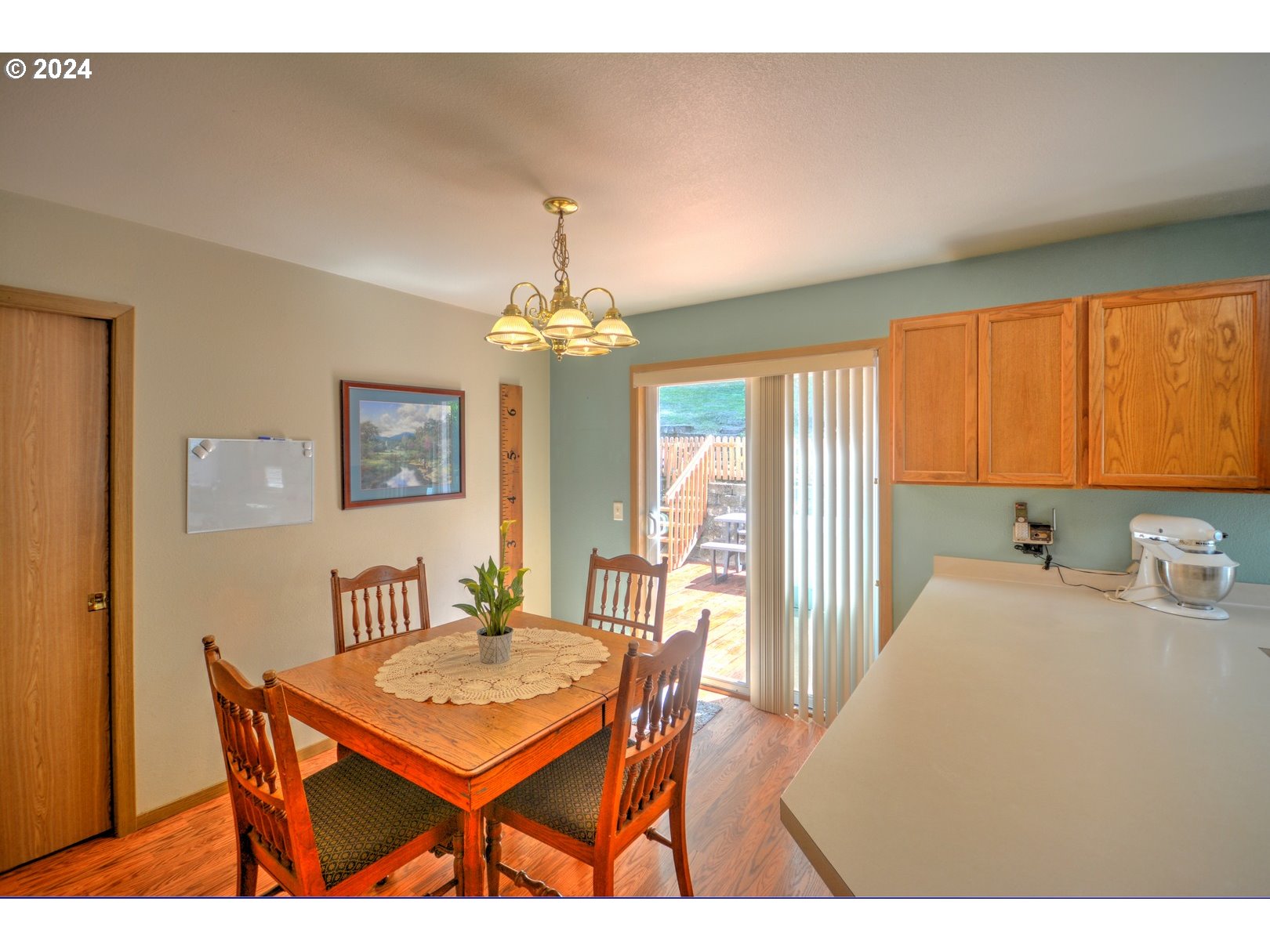421 Elk Creek Road Cannon Beach, OR 97110 - Photo 6 of 16 a living room with a table or chairs and a dining table