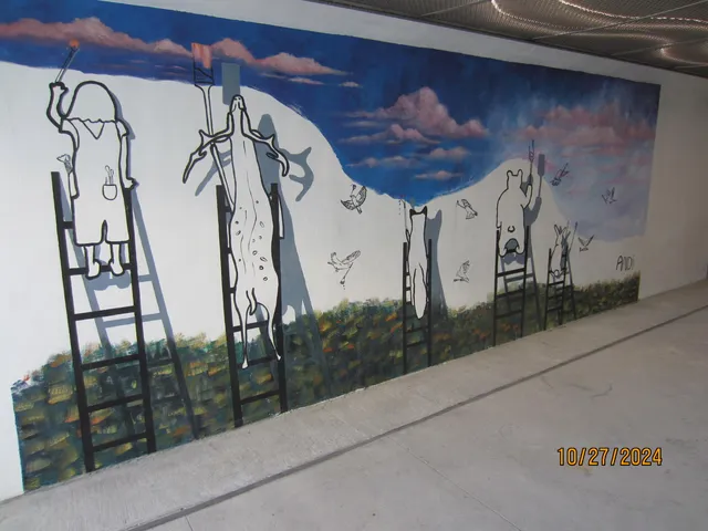 a view of a gallery with wooden floor