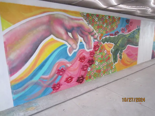 a vase of flowers sitting on a floor